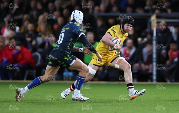 280226 - Dragons RFC v Benetton Rugby - United Rugby Championship - Evan Minto of Dragons is challenged by Jacob Umaga of Benetton Rugby 