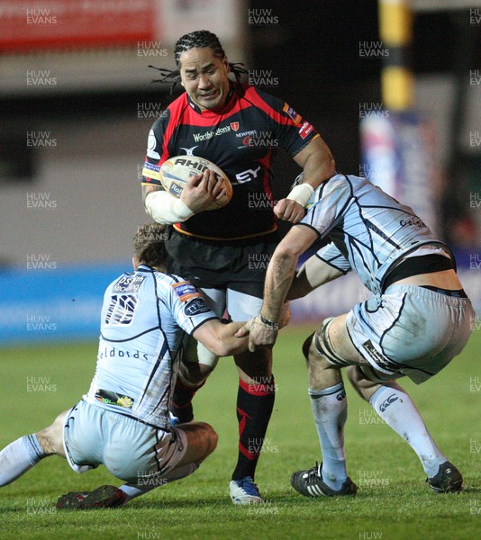 150312 -  Newport Gwent Dragons v Cardiff Blues, RaboDirect PRO12 - Dragons Andy Tuilagi drives into Blues Dan Parks  and Blues Mike Paterson   