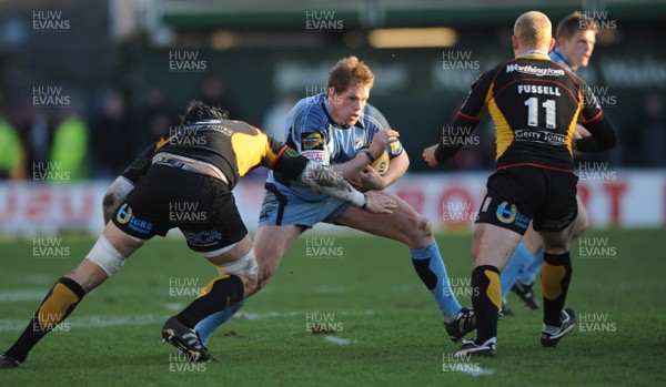 26.12.08 - Newport-Gwent Dragons v Cardiff Blues - Magners League - Cardiff's Rhys Thomas is tackled by Luke Charteris. 