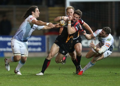 261213 - Newport Gwent Dragons v Cardiff Blues, RaboDirect PRO12 - Dragons Hallam Amos is tackled by Blues' Alex Cuthbert and Blues' Josh Navidi