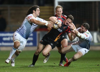 261213 - Newport Gwent Dragons v Cardiff Blues, RaboDirect PRO12 - Dragons Hallam Amos is tackled by Blues' Alex Cuthbert and Blues' Josh Navidi