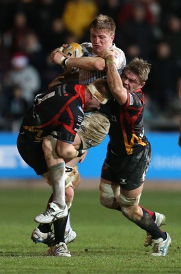 261213 - Newport Gwent Dragons v Cardiff Blues, RaboDirect PRO12 - Blues' Macauley Cook is tackled by Dragons Andrew Coombs and Dragons Lewis Evans