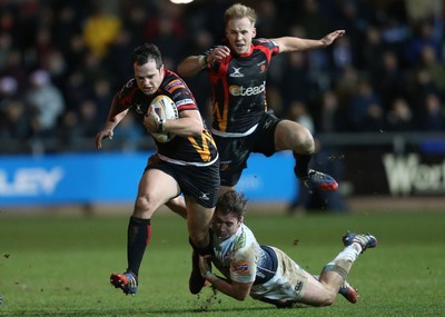 261213 - Newport Gwent Dragons v Cardiff Blues, RaboDirect PRO12 - Dragons Dan Evans gets away from Blues' Dafydd Hewitt, with Dragons Ashley Smith is support