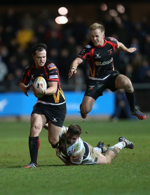 261213 - Newport Gwent Dragons v Cardiff Blues, RaboDirect PRO12 - Dragons Dan Evans gets away from Blues' Dafydd Hewitt, with Dragons Ashley Smith is support