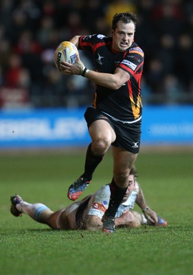 261213 - Newport Gwent Dragons v Cardiff Blues, RaboDirect PRO12 - Dragons Dan Evans gets away from Blues' Dafydd Hewitt