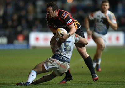 261213 - Newport Gwent Dragons v Cardiff Blues, RaboDirect PRO12 - Dragons Dan Evans is tackled by Blues' Leigh Halfpenny