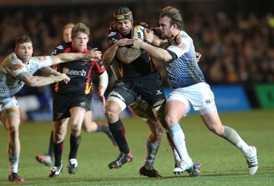 261213 - Newport Gwent Dragons v Cardiff Blues, RaboDirect PRO12 - Dragons Netani Talei is tackled by Blues' Kristian Dacey and Dafydd Hewitt