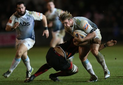 261213 - Newport Gwent Dragons v Cardiff Blues, RaboDirect PRO12 - Blues' Kristian Dacey is tackled by Dragons Toby Faletau