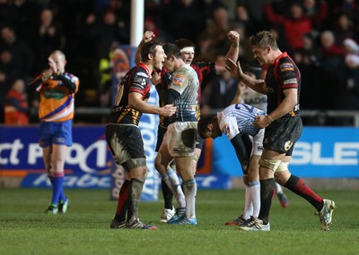 261213 - Newport Gwent Dragons v Cardiff Blues, RaboDirect PRO12 - Dragons Jason Tovey and Dragons Lewis Evans celebrate the win as the whistle blows