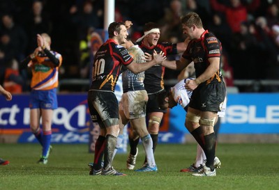 261213 - Newport Gwent Dragons v Cardiff Blues, RaboDirect PRO12 - Dragons Jason Tovey and Dragons Lewis Evans celebrate the win as the whistle blows