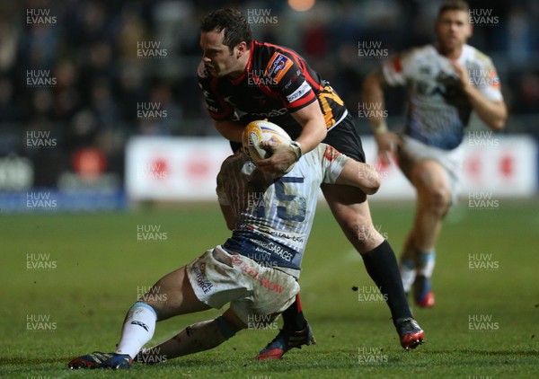 261213 - Newport Gwent Dragons v Cardiff Blues, RaboDirect PRO12 - Dragons Dan Evans is tackled by Blues' Leigh Halfpenny