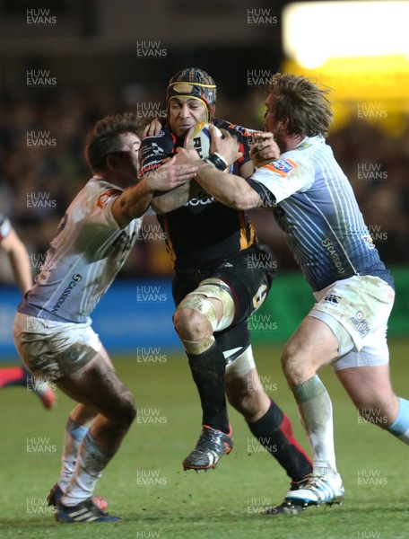 261213 - Newport Gwent Dragons v Cardiff Blues, RaboDirect PRO12 - Dragons Netani Talei is tackled by Blues' Kristian Dacey and Dafydd Hewitt