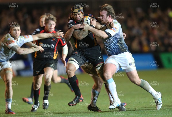 261213 - Newport Gwent Dragons v Cardiff Blues, RaboDirect PRO12 - Dragons Netani Talei is tackled by Blues' Kristian Dacey and Dafydd Hewitt