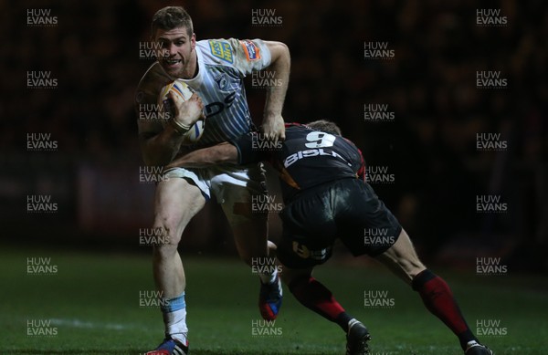 261213 - Newport Gwent Dragons v Cardiff Blues, RaboDirect PRO12 - Blues' Dafydd Hewitt is tackled by Dragons Wayne Evans