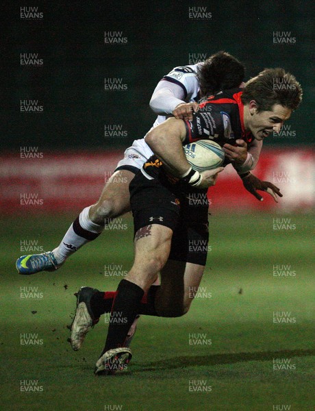 061213 - Newport Gwent Dragons v Bordeaux-Begles, Amlin Challenge Cup - Dragons Matthew Pewtner is tackled by Bordeaux-Begles Robert Lilomaiava