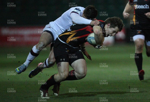 061213 - Newport Gwent Dragons v Bordeaux-Begles, Amlin Challenge Cup - Dragons Matthew Pewtner is tackled by Bordeaux-Begles Robert Lilomaiava