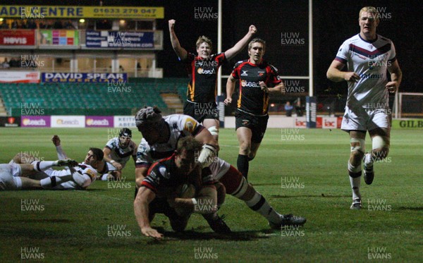 061213 - Newport Gwent Dragons v Bordeaux-Begles, Amlin Challenge Cup - Dragons Patrick Leach beats Bordeaux-Begles Gautier Gibouin as he dives in to score try