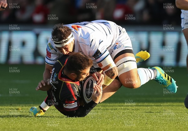 061018 - Dragons v Cardiff Blues, Guinness PRO14 - Jordan Williams of Dragons is tackled by Josh Turnbull of Cardiff Blues