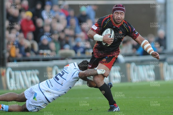 061018 - Dragons v Cardiff Blues - Guinness Pro 14 - Brandon Nansen of the Dragons is tackled by Willis Halaholo of the Cardiff Blues