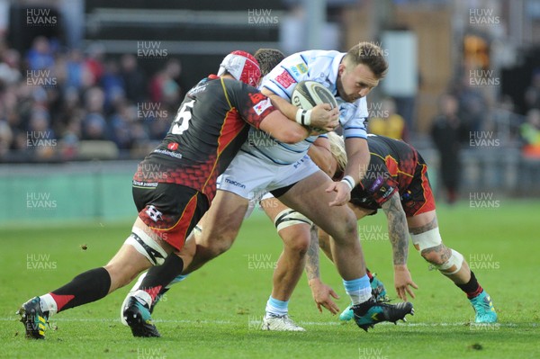 061018 - Dragons v Cardiff Blues - Guinness Pro 14 -  Dillon Lewis of the Cardiff Blues is tackled by Cory Hill of the Dragons