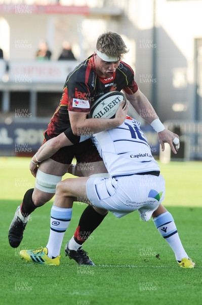061018 - Dragons v Cardiff Blues - Guinness Pro 14 -  Aaron Wainwright of the Dragons is tackled by Gareth Anscombe of the Cardiff Blues