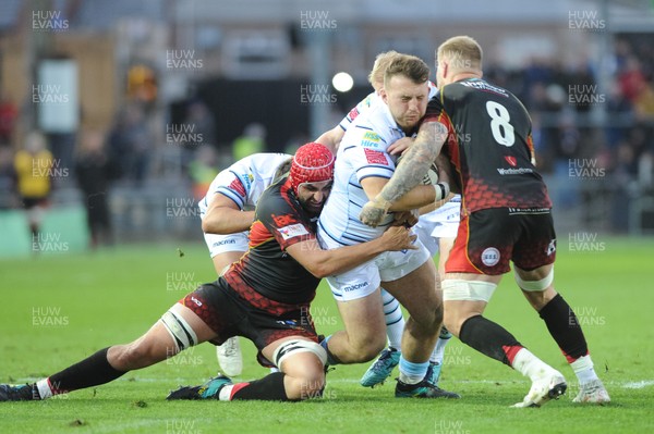 061018 - Dragons v Cardiff Blues - Guinness Pro 14 -  Dillon Lewis of the Cardiff Blues is tackled by Cory Hill of the Dragons and Ross Moriarty of the Dragons