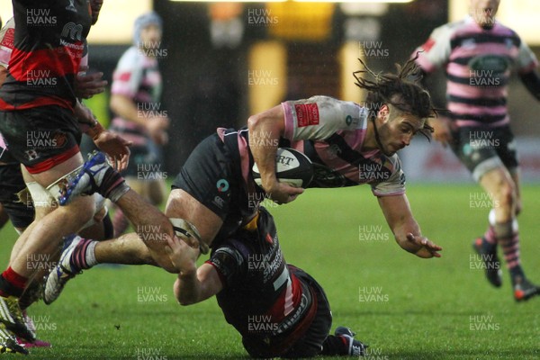 261217 - Dragons v Cardiff Blues- GuinnessPro14  - Josh Navidi of Cardiff Blues is tackled by James Benjamin of Dragons