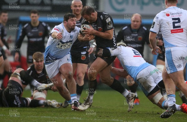 261220 - Dragons v Cardiff Blues - Guinness PRO14 - Jamie Roberts of Dragons is tackled by Brad Thyer and Josh Turnbull of Cardiff Blues