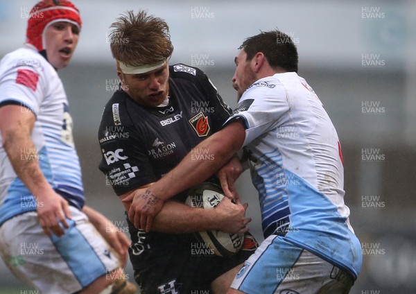 261220 - Dragons v Cardiff Blues - Guinness PRO14 - Aaron Wainwright of Dragons is tackled by Brad Thyer of Cardiff Blues