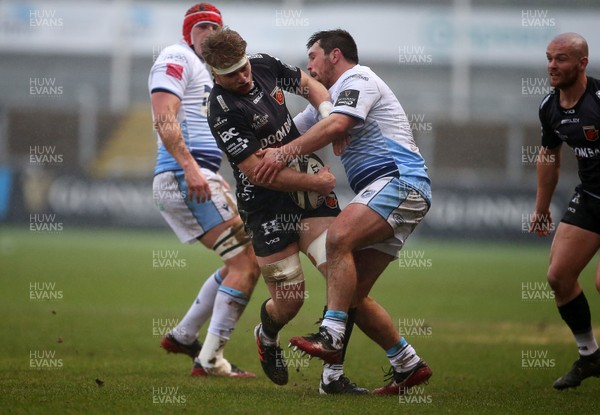 261220 - Dragons v Cardiff Blues - Guinness PRO14 - Aaron Wainwright of Dragons is tackled by Brad Thyer of Cardiff Blues