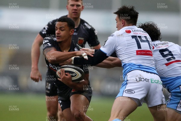 261220 - Dragons v Cardiff Blues - Guinness PRO14 - Ashton Hewitt of Dragons is tackled by Josh Adams of Cardiff Blues