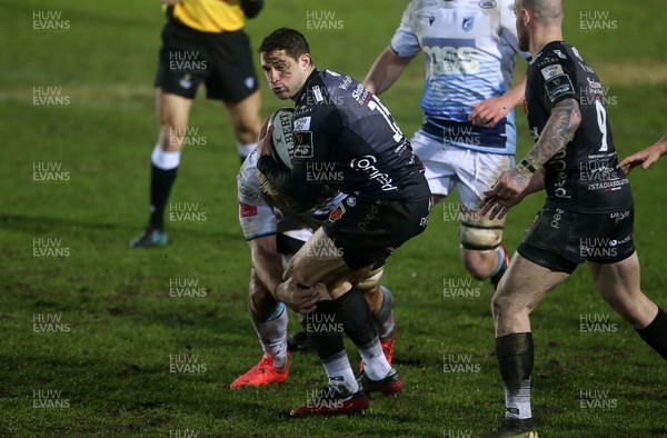 261220 - Dragons v Cardiff Blues - Guinness PRO14 - Jonah Holmes of Dragons is tackled by Josh Turnbull of Cardiff Blues