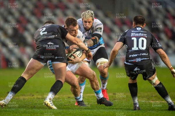 261220 - Dragons v Cardiff Blues - Guinness PRO14 - Kristian Dacey of Cardiff Blues is tackled by Elliot Dee of Dragons