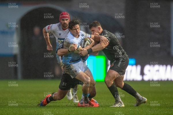 261220 - Dragons v Cardiff Blues - Guinness PRO14 - Lloyd Williams of Cardiff Blues is tackled by Brok Harris of Dragons and Elliot Dee of Dragons