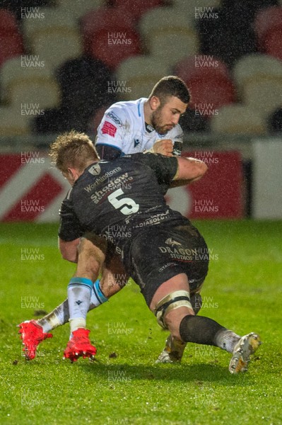 261220 - Dragons v Cardiff Blues - Guinness PRO14 - Matthew Screech of Dragons tackles Aled Summerhill of Cardiff Blues