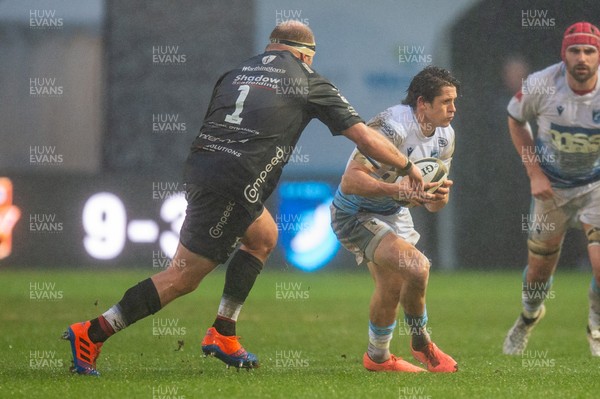261220 - Dragons v Cardiff Blues - Guinness PRO14 - Lloyd Williams of Cardiff Blues is tackled by Brok Harris of Dragons