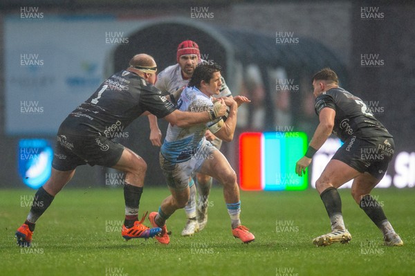 261220 - Dragons v Cardiff Blues - Guinness PRO14 - Lloyd Williams of Cardiff Blues is tackled by Brok Harris of Dragons