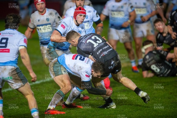 261220 - Dragons v Cardiff Blues - Guinness PRO14 - Jack Dixon of Dragons is tackled by Max Llewellyn of Cardiff Blues