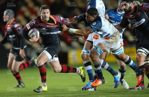 150116 - Newport Gwent Dragons v Castres, European Challenge Cup - Jason Tovey of Newport Gwent Dragons is tackled by Mathieu Babillot of Castres