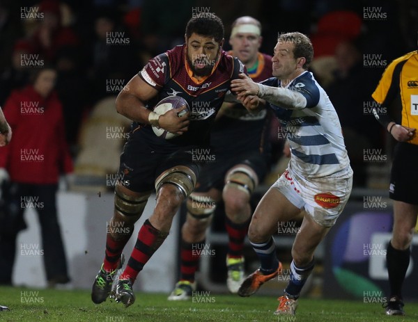 150116 - Newport Gwent Dragons v Castres, European Challenge Cup - Taulupe Faletau of Newport Gwent Dragons takes on Julien Seron of Castres