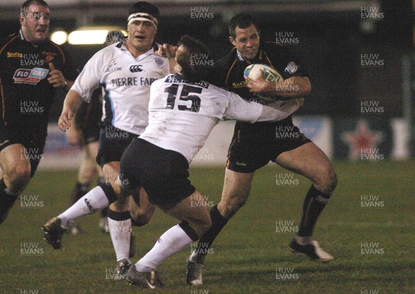 210106 - Heineken Cup Rugby Newport Gwent Dragons v Castres Dragons' Gareth Cooper is tackled by Phil Christophers 