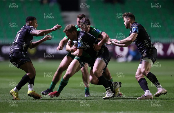 040323 - Dragons v Connacht - United Rugby Championship - Angus O'Brien of Dragons is tackled by Tom Farrell of Connacht