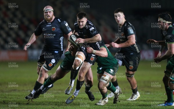 050221 - Dragons v Connacht, Guinness PRO14 - Josh Lewis of Dragons is tackled by the Connacht defence
