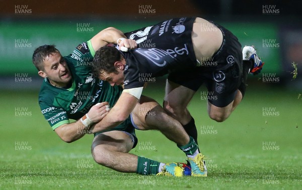 111019 - Dragons v Connacht - Guinness PRO14 - Adam Warren of Dragons is tackled by Caolin Blade of Connacht