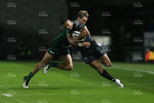 111019 - Dragons v Connacht, Guinness PRO14 - Ashton Hewitt of Dragons is tackled by John Porch of Connacht