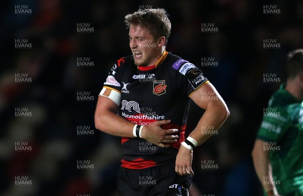 150917 - Dragons Rugby v Connacht - Guinness PRO14 - Tyler Morgan of Dragons clutches his ribs during the game and goes off injured minutes later