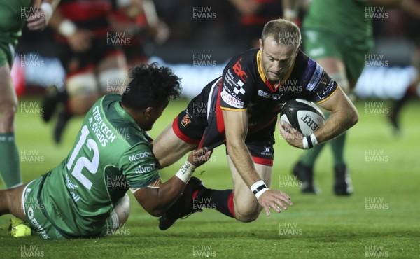 150917 - Dragons v Connacht, Guinness Pro14 - Sarel Pretorius of Dragons is tackled by Bundee Aki of Connacht