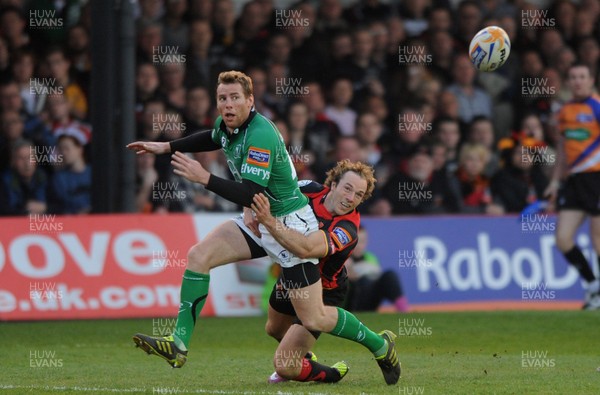 300312 - Newport-Gwent Dragons v Connacht - RaboDirect PRO12 -Gavin Duffy of Connacht is tackled by Will Harries of Newport-Gwent Dragons