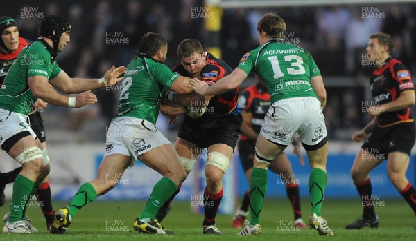 300312 - Newport-Gwent Dragons v Connacht - RaboDirect PRO12 -Dan Lydiate of Newport-Gwent Dragons is tackled by Ethienne Reynecke of Connacht