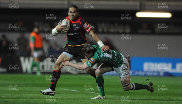 300312 - Newport-Gwent Dragons v Connacht - RaboDirect PRO12 -Andy Tuilagi of Newport-Gwent Dragons is tackled by Kyle Tonetti of Connacht